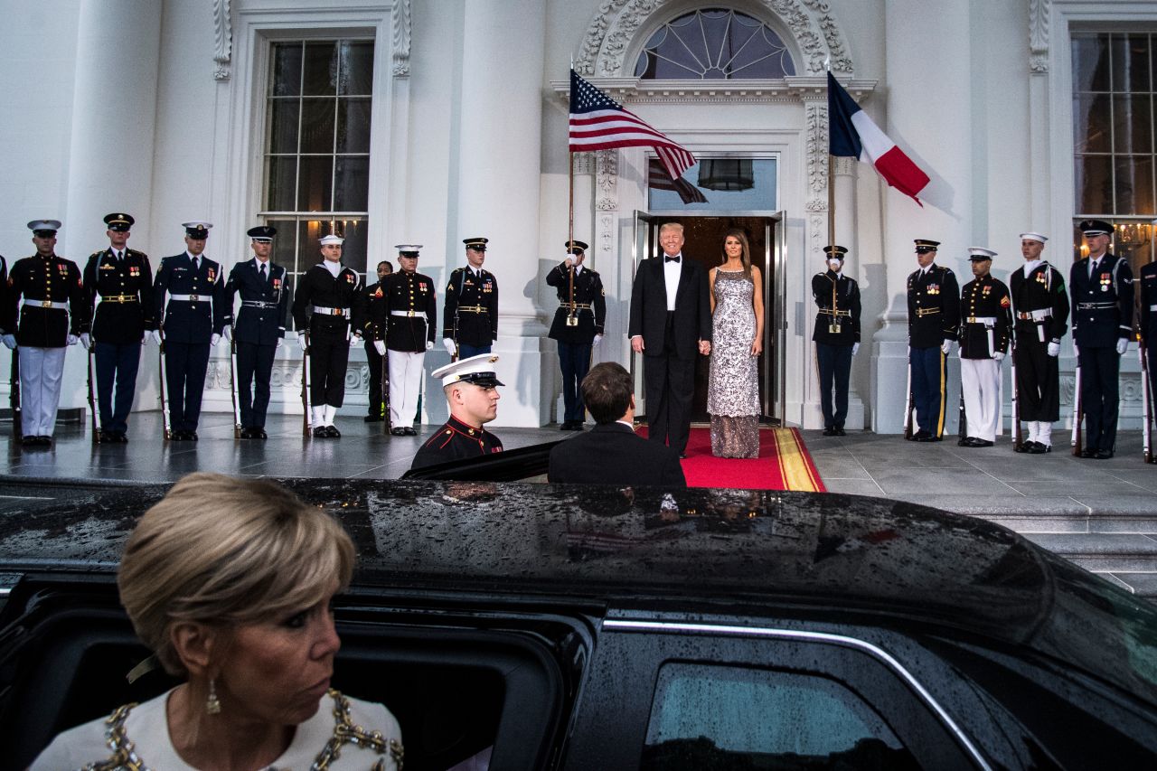 US President Donald Trump and first lady Melania Trump greet Macron and his wife, Brigitte, at the state dinner in 2018.