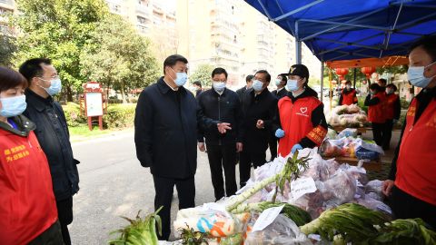 Chinese leader Xi Jinping visits a community in Wuhan in March 2020, following the initial outbreak of the coronavirus in the city.