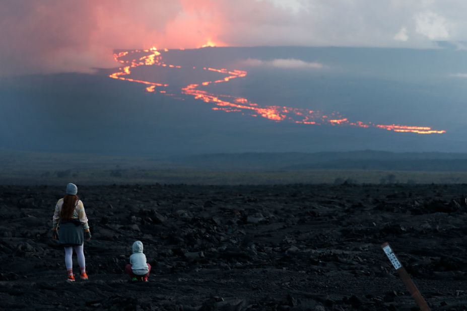 Hawaii officials have said the simultaneous eruptions of Mauna Loa and the Kilauea volcano are not threatening homes or nearby infrastructure.