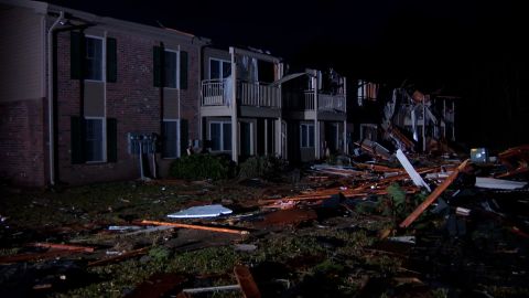 Debris is scattered in front of the damaged apartment building in Eutaw, Alabama.