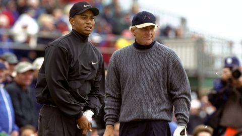 Woods and Norman play at the Open Championship in Carnoustie, Scotland, in 1999.