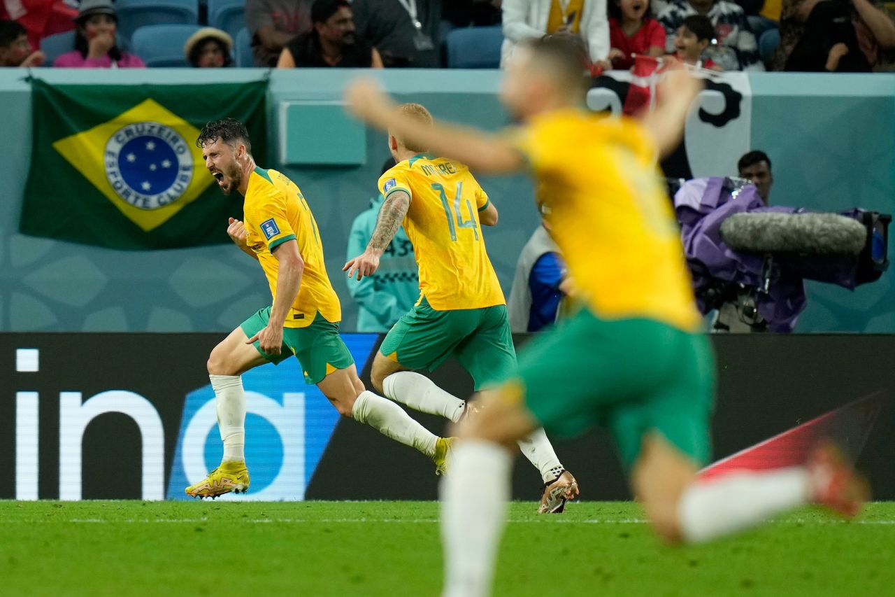 Australia's Mathew Leckie, left, celebrates after scoring the only goal in the 1-0 win over Denmark on Wednesday. The win advanced the "Socceroos" to the knockout stage.