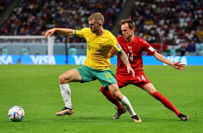 Australia's Riley McGree shields the ball from Denmark's Mikkel Damsgaard.