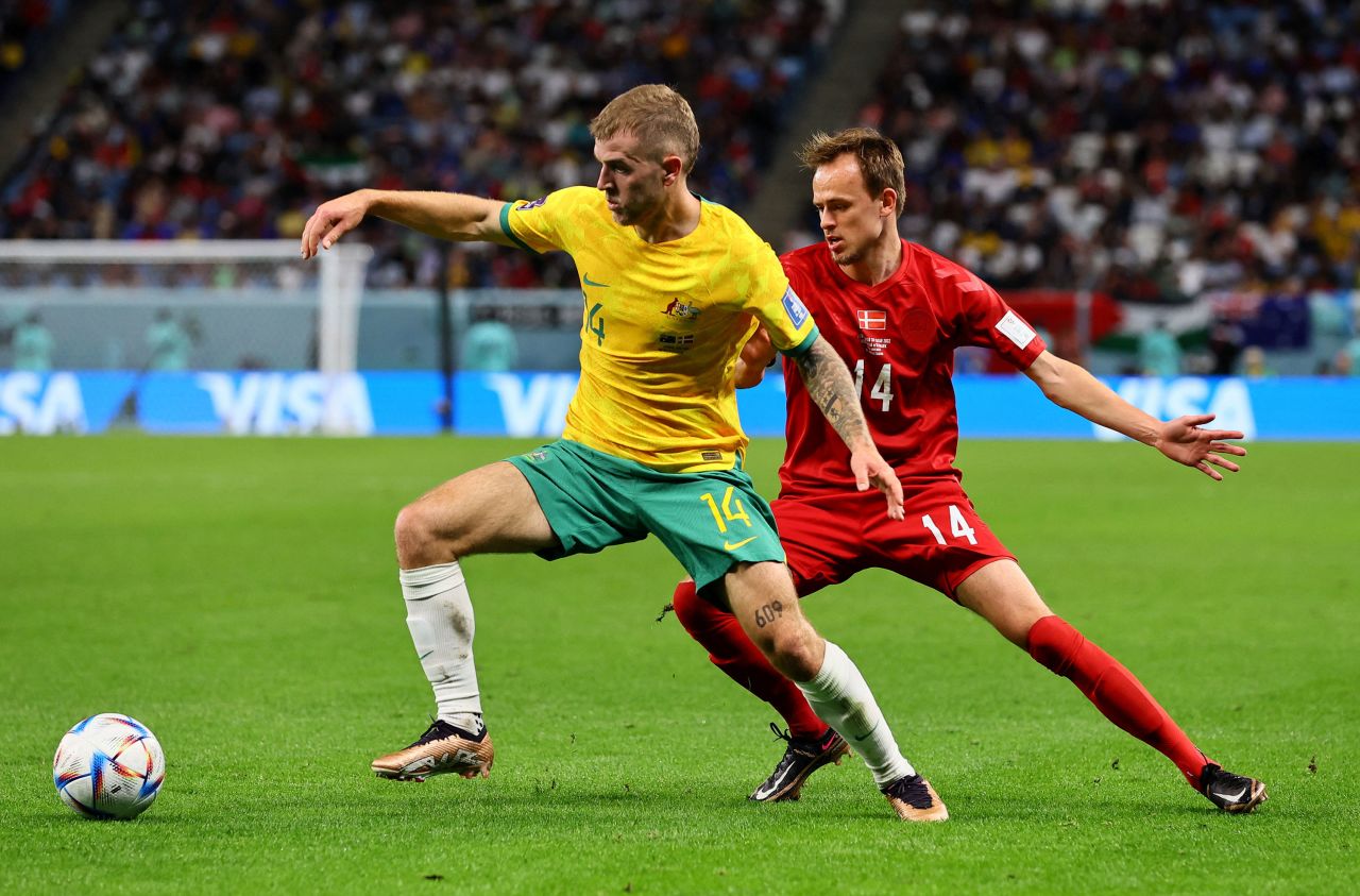 Australia's Riley McGree shields the ball from Denmark's Mikkel Damsgaard.