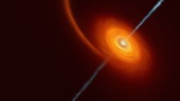 This artist's impression illustrates how it might look when a star approaches too close to a black hole, where the star is squeezed by the intense gravitational pull of the black hole. Some of the star's material gets pulled in and swirls around the black hole forming the disc that can be seen in this image. In rare cases, such as this one, jets of matter and radiation are shot out from the poles of the black hole. In the case of the AT2022cmc event, evidence of the jets was detected by various telescopes including the VLT, which determined this was the most distant example of such an event.