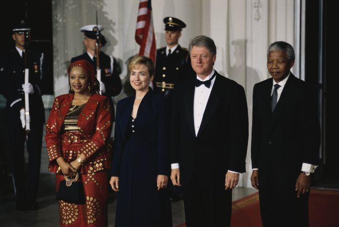 US President Bill Clinton and first lady Hillary Clinton stand with Mandela and his daughter Zindzi before the state dinner in 1994.