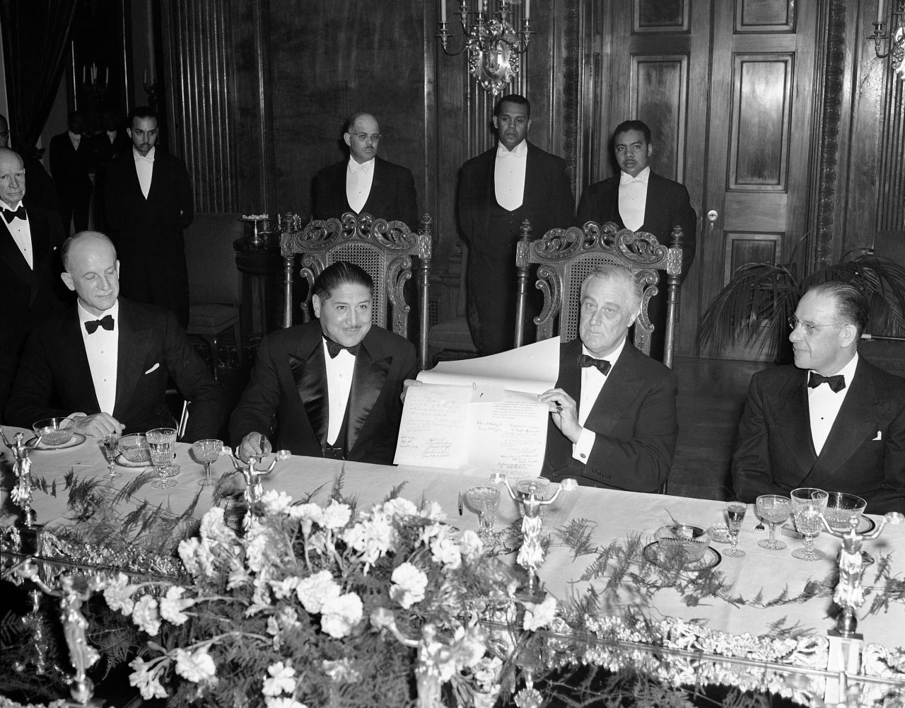 US President Franklin D. Roosevelt holds up the United Nations Declaration next to Bolivian President Enrique Penaranda after Penaranda signed it during a state dinner at the White House in 1943. "Roosevelt is really the first to start using the dinners a bit more strategically," Matthew Costello, a historian with the White House Historical Association, said in 2020.