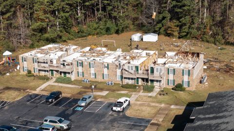 Debris is scattered around a damaged apartment building in Eutaw, Alabama.