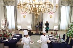 First Lady Jill Biden and White House staff present the menu during a media preview ahead of the state dinner in honor of French President Emmanuel Macron, in the State Dining Room of the White House.