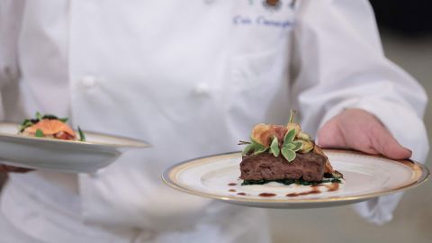 White House Executive Chef Cris Comerford presents the menu during a media preview ahead of the State Dinner in honor of French President Emmanuel Macron, in the State Dining Room of the White House in Washington, DC, on November 30, 2022. 