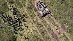 Dnipropetrovsk Oblast, UKRAINE - MAY 09: In this aerial view, A Ukrainian Army tank moves to drive over an infantryman during a training exercise on May 09, 2022 near Dnipropetrovsk Oblast, Ukraine. Infantry soldiers learned scenarios to survive when potentially confronted with a Russian tank closing in at close range. The frontline with Russian troops lies only 70km to the south in Kherson Oblast, most of which is controlled by Russia. (Photo by John Moore/Getty Images)
