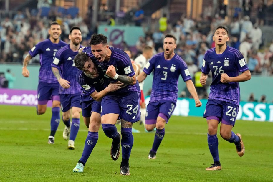 Argentina's Julian Alvarez is put in a headlock by teammate Enzo Fernandez after scoring against Poland on November 30. Argentina won 2-0 to finish first in Group C and advance to the knockout stage. Poland qualified as well despite the loss.