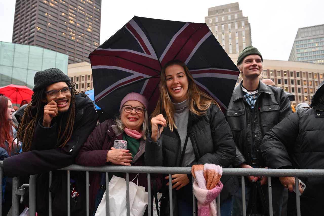 People in Boston await the royal couple's arrival at City Hall Plaza on Wednesday.