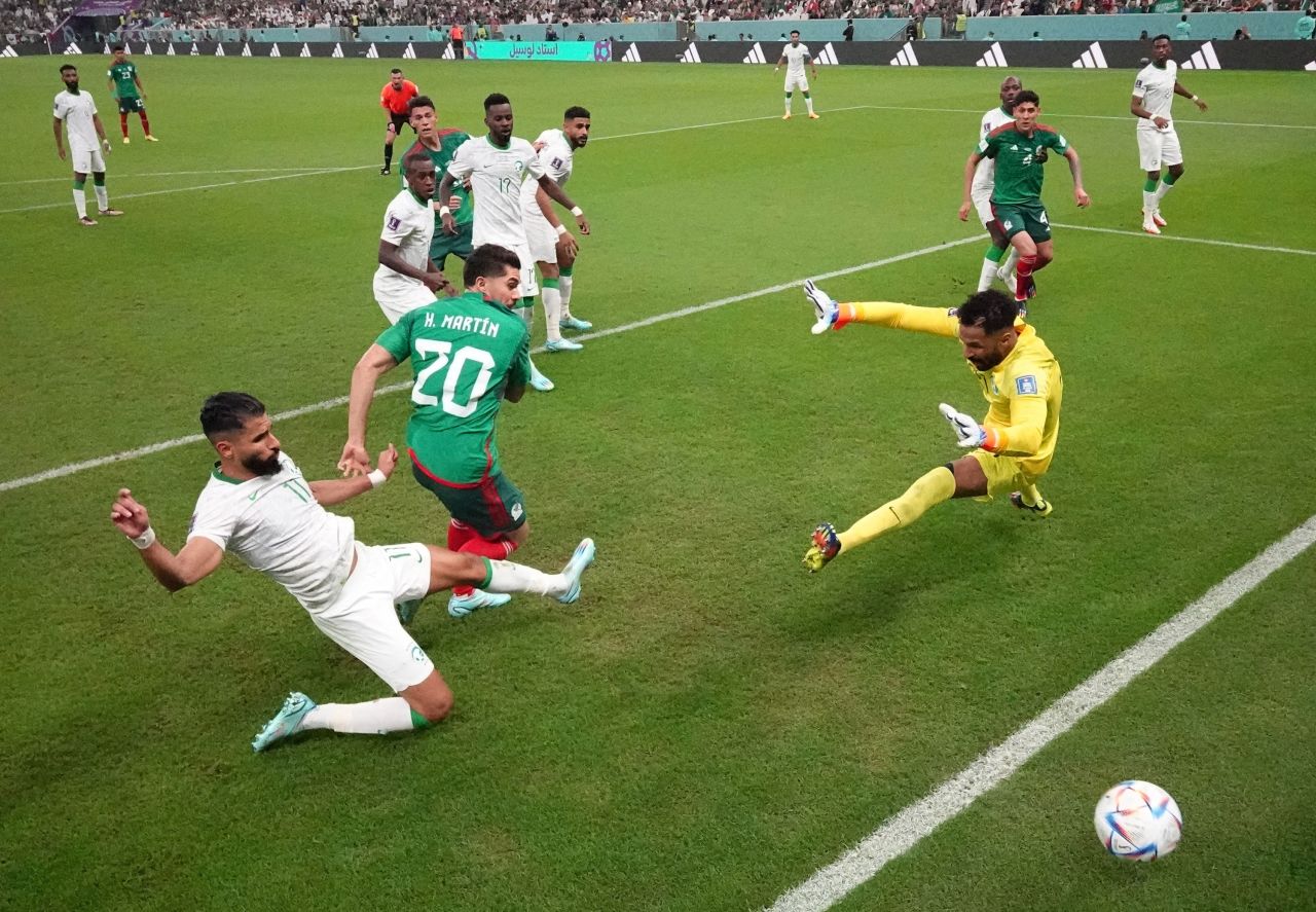 Mexico's Henry Martín scores the first goal against Saudi Arabia.