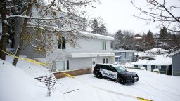 Police tape surrounds the residence where four University of Idaho students were killed as Moscow Police monitor the scene in Moscow, Idaho, U.S., November 30, 2022.  REUTERS/Lindsey Wasson