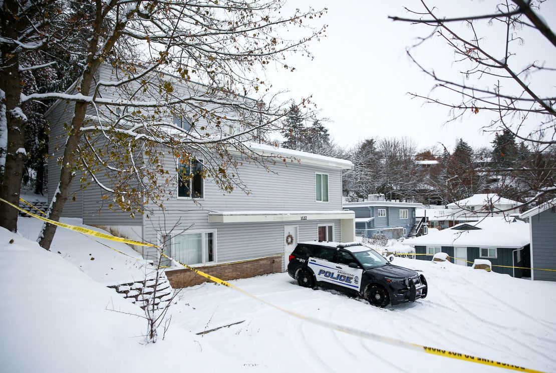 Police tape surrounds the residence where four University of Idaho students were killed as police monitor the scene November 30 in Moscow, Idaho.