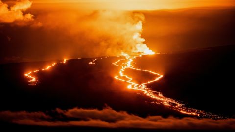 Lava fountains and flows illuminate the area during the Mauna Loa volcano eruption in Hawaii, U.S. November 30, 2022.  REUTERS/Go Nakamura