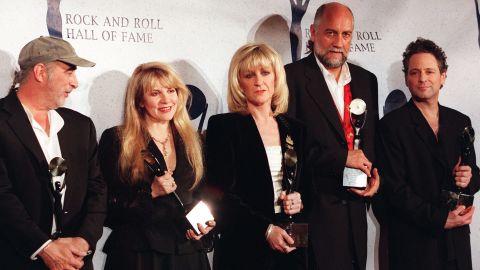 After Fleetwood Mac was inducted into the Rock & Roll Hall of Fame successful  1998, Christine McVie (third from left) discontinue  the band.