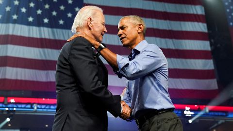 US President Joe Biden shakes hands with former President Barack Obama as they attend a campaign event in Philadelphia for Democratic candidates running for governor and the US Senate.