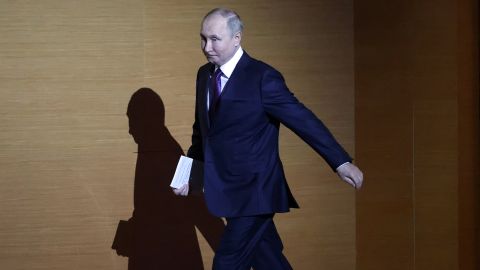 Russian President Vladimir Putin enters the hall during the plenary session of the 10th All-Russia's Congress of Judges at the State Kremlin Palace on November 29, 2022, in Moscow.