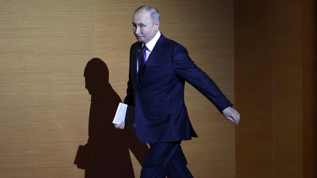 Russian President Vladimir Putin enters the hall during the plenary session of the 10th All-Russia's Congress of Judges at the State Kremlin Palace on November 29, 2022, in Moscow.