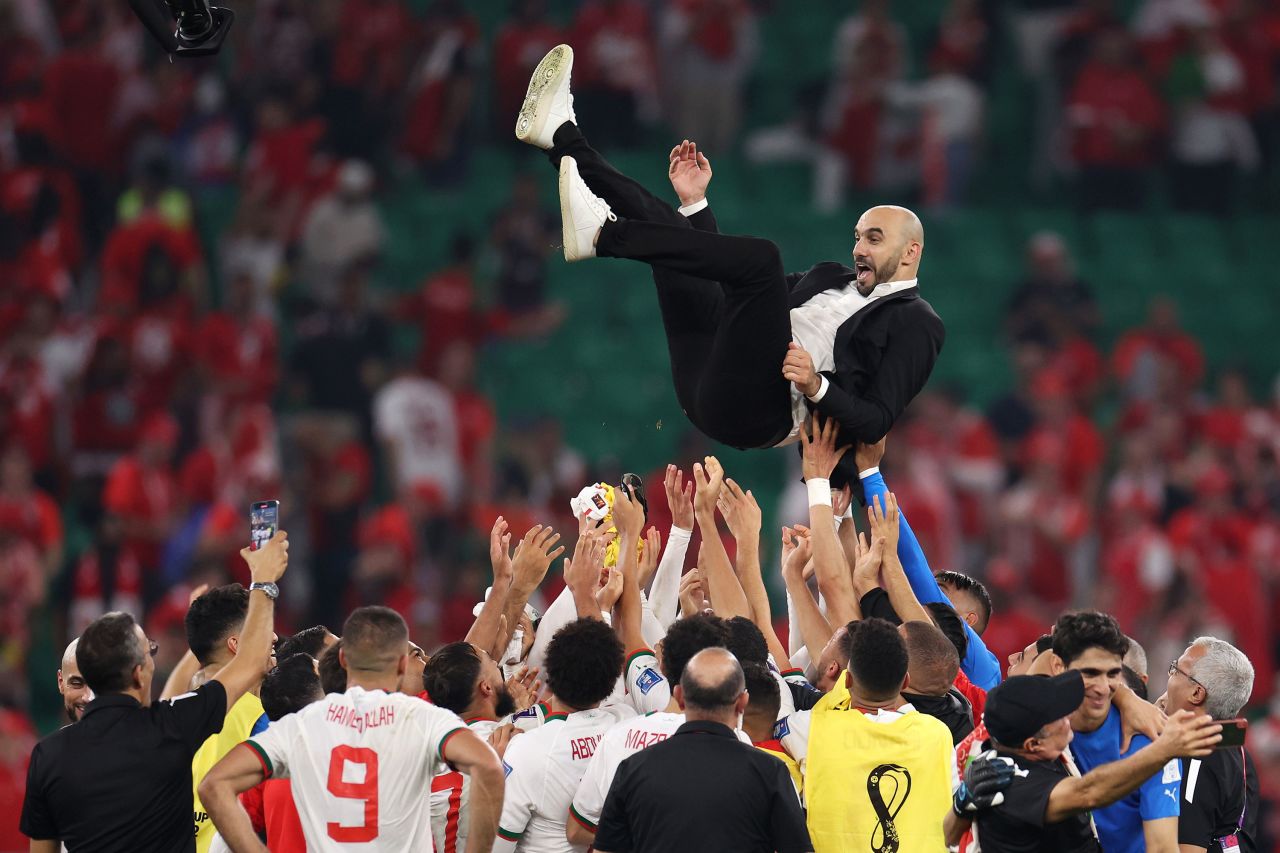 Morocco head coach Walid Regragui is lifted into the air by his team after a 2-1 victory over Canada on December 1. Morocco finished first in Group F.