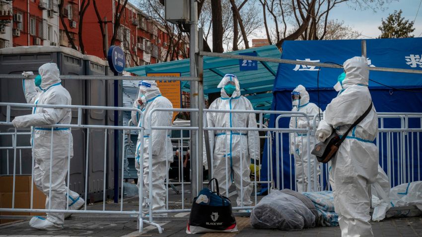 Epidemic control workers wear PPE to prevent the spread of COVID-19 as they stand guard outside a community in lockdown on November 29, 2022 in Beijing, China.