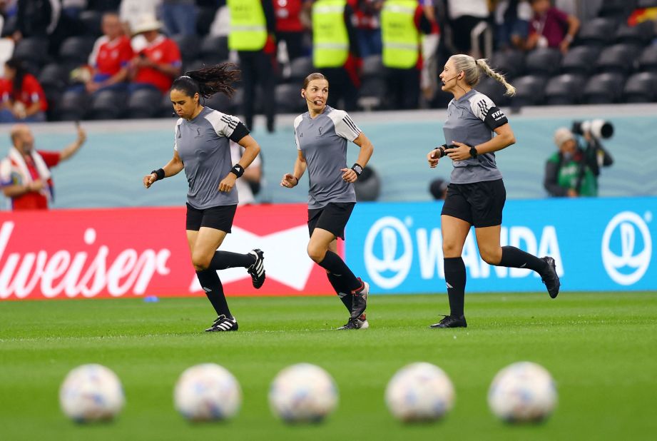 Referee Stephanie Frappart, center, warms up with assistant referees Karen Diaz, left, and Neuza Back before the Germany-Costa Rica match. <a href="https://www.cnn.com/sport/live-news/world-cup-2022-12-01-2022/h_9e54a9b7b64fac9df31c09b2f48fcc93" target="_blank">They made history</a> as the first all-female refereeing crew for a men's World Cup match. Frappert became the first woman to referee a men's World Cup match.