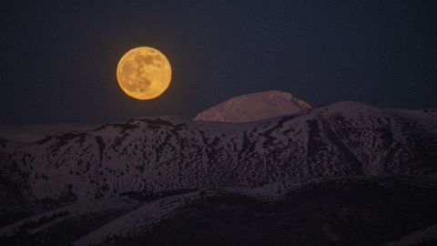 The 2021 cold moon rises at sunset behind Monte Camicia in Italy's Gran Sasso National Park on December 19. This year, the moon will be at its fullest the night of December 7.