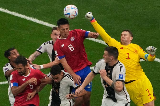 German goalkeeper Manuel Neuer punches a ball clear against Costa Rica.