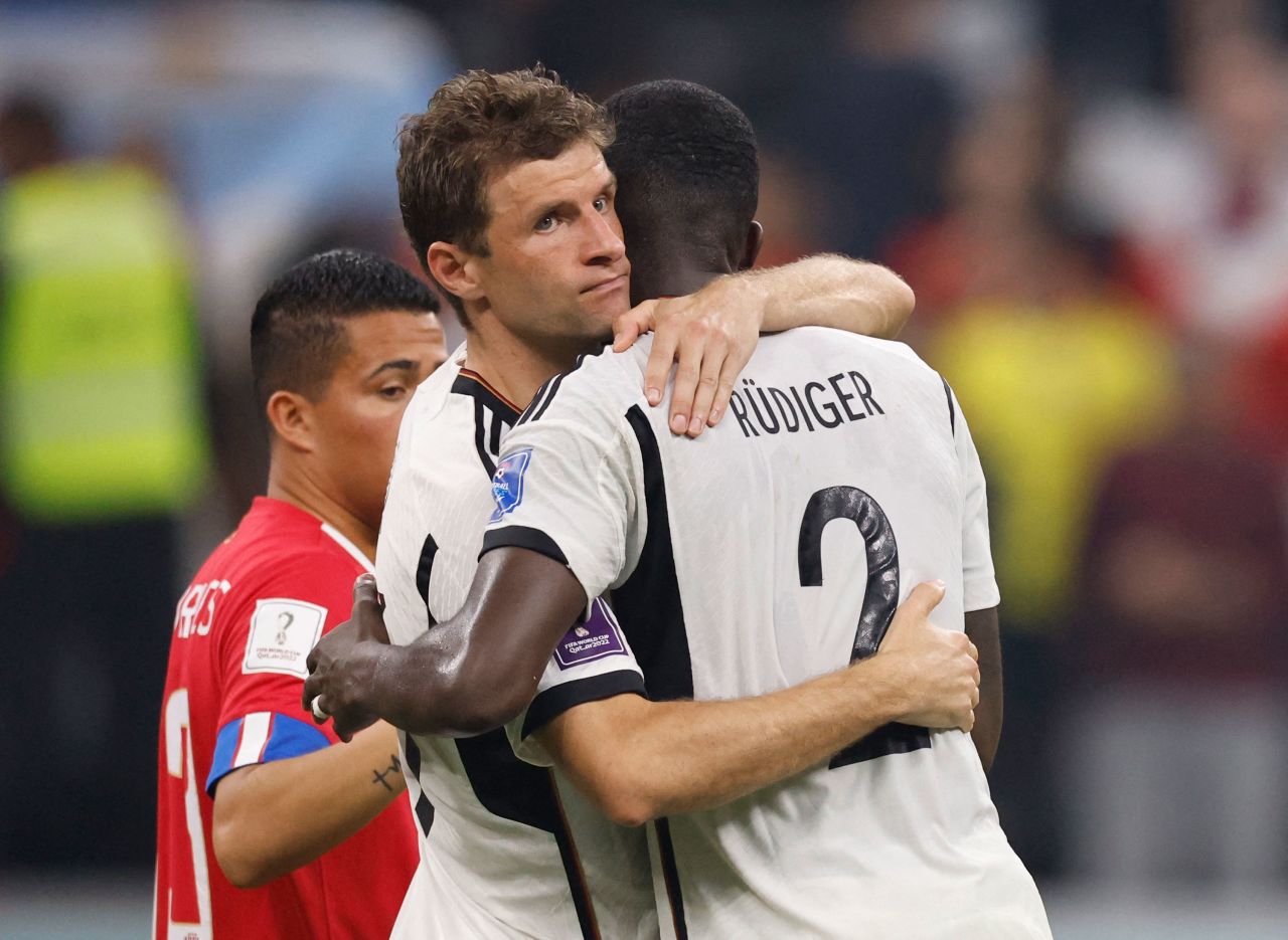Germany's Thomas Müller hugs Antonio Rüdiger after their 4-2 win over Costa Rica on Thursday. Despite the win, Germany was eliminated from the tournament because Japan defeated Spain.