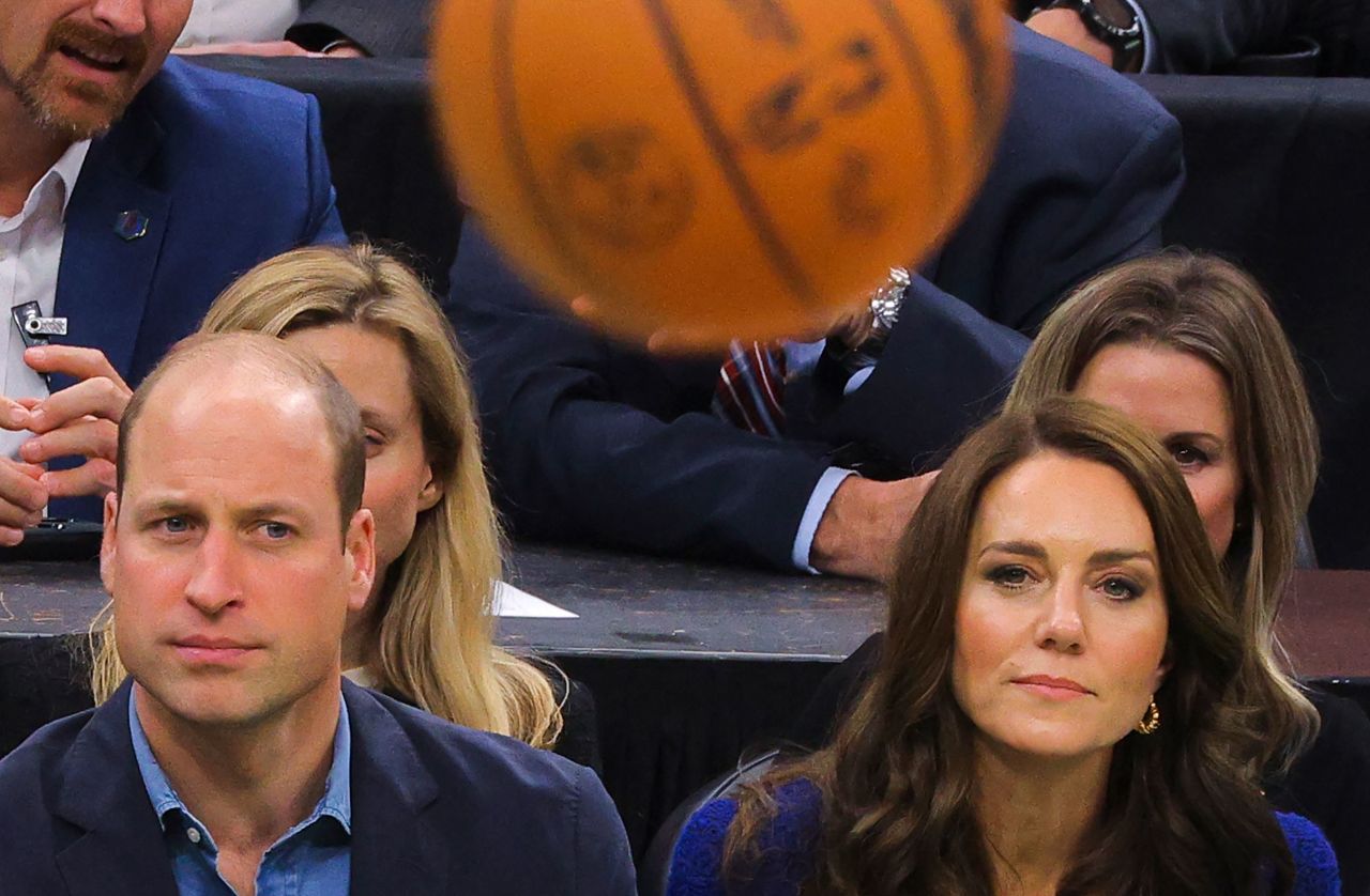 Britain's Prince William and his wife Catherine, Princess of Wales, watch an NBA basketball game while <a href=