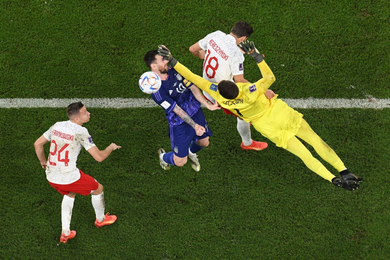 Argentina star Lionel Messi is hit in the face by Poland's Wojciech Szczesny in the first half of their World Cup match on Wednesday, November 30. A penalty was given after video review, but Szczesny saved Messi's shot. <a href="https://www.cnn.com/2022/11/20/football/gallery/world-cup-2022/index.html" target="_blank">See the best photos of the 2022 World Cup</a>.