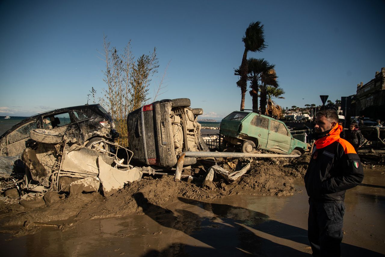 Vehicles are piled up on a beach after a <a href=