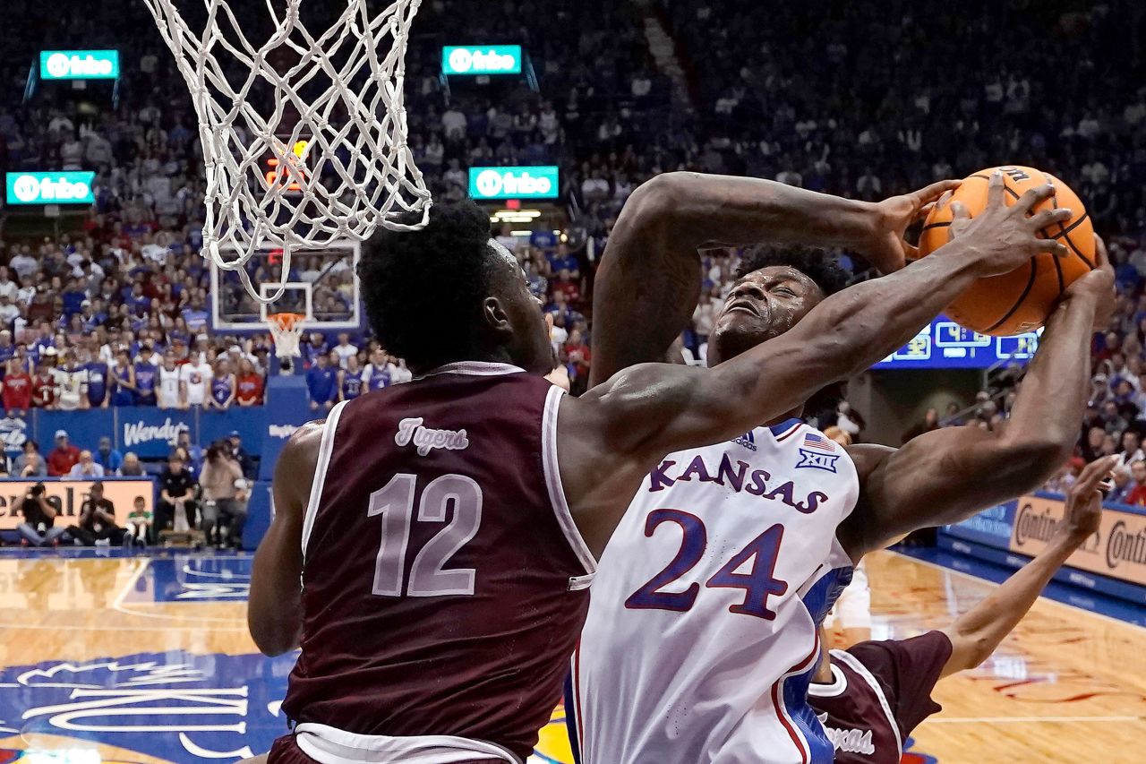 Kansas forward K.J. Adams Jr. is defended by Texas Southern's Zytarious Mortle during a college basketball game in Lawrence, Kansas, on Monday, November 28.