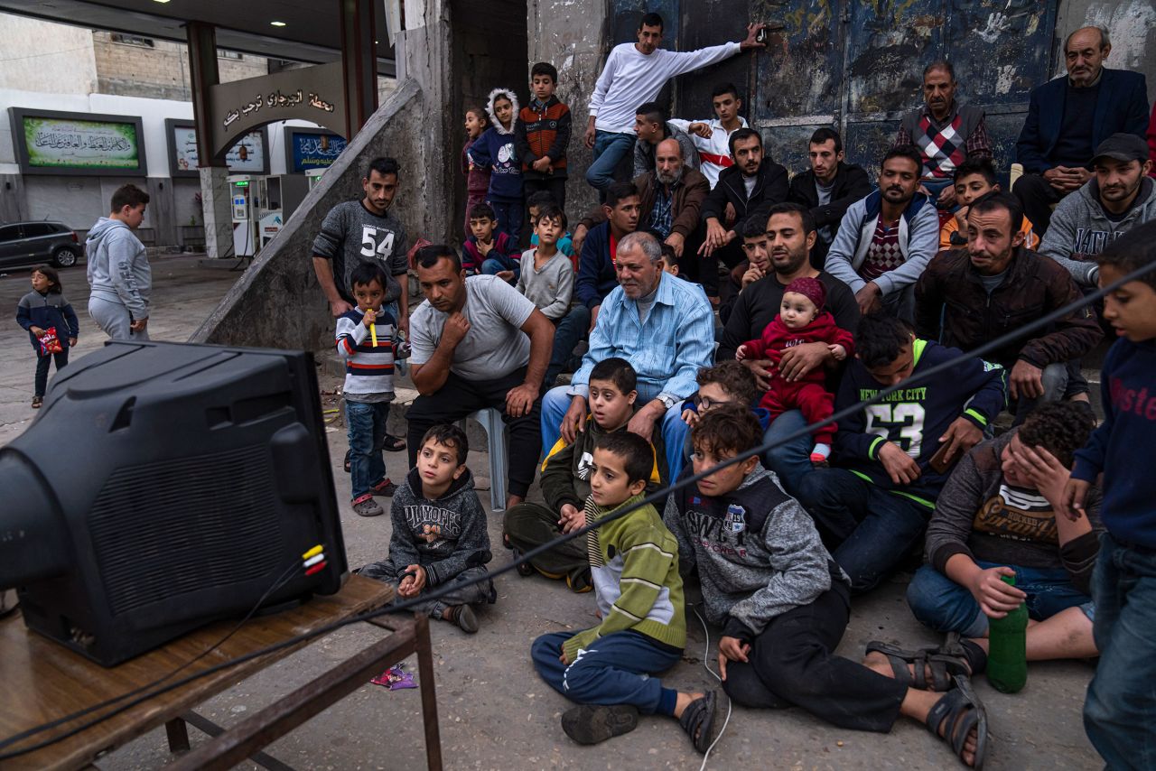 People watch the World Cup together in Gaza City on Monday, November 28.