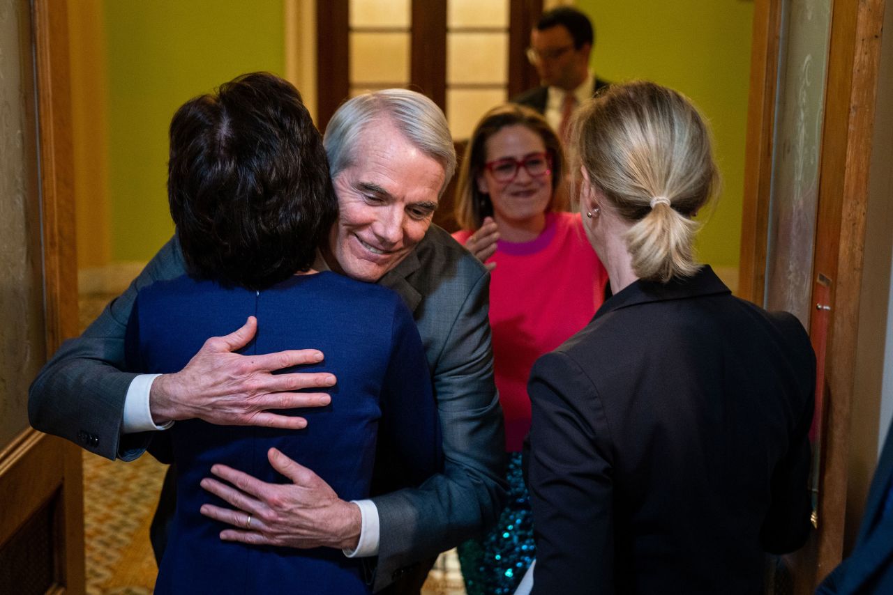 US Sen. Rob Portman hugs US Sen. Susan Collins after the bipartisan Respect for Marriage Act <a href="https://www.cnn.com/2022/11/29/politics/same-sex-marriage-vote-senate" target="_blank">was passed by the Senate</a> on Tuesday, November 29. At right are US Sens. Kyrsten Sinema and Tammy Baldwin. The legislation would protect same-sex and interracial marriage. It now goes to the House, which is expected to pass it before the end of the year.