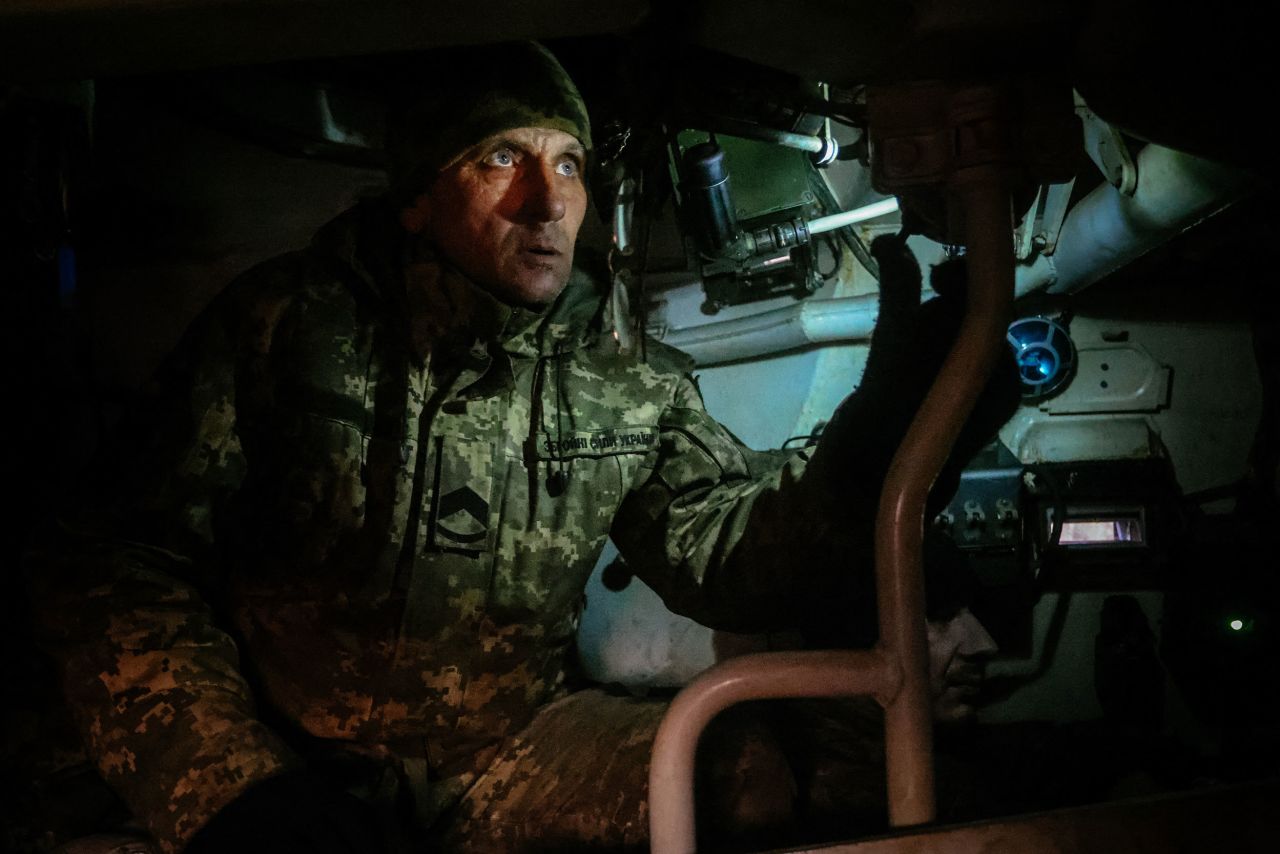 A Ukrainian soldier looks through an artillery periscope while stationed on the front lines in eastern Ukraine on Wednesday, November 30.