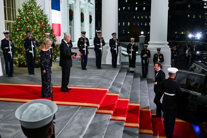 US President Joe Biden and first lady Jill Biden greet French President Emmanuel Macron and his wife, Brigitte, as they arrive for a <a href="index.php?page=&url=http%3A%2F%2Fwww.cnn.com%2F2022%2F12%2F01%2Fpolitics%2Fgallery%2Fmacron-biden-white-house-state-dinner%2Findex.html" target="_blank">state dinner</a> at the White House in December 2022. It was the first state dinner of the Biden administration, and the first since the start of the Covid-19 pandemic.