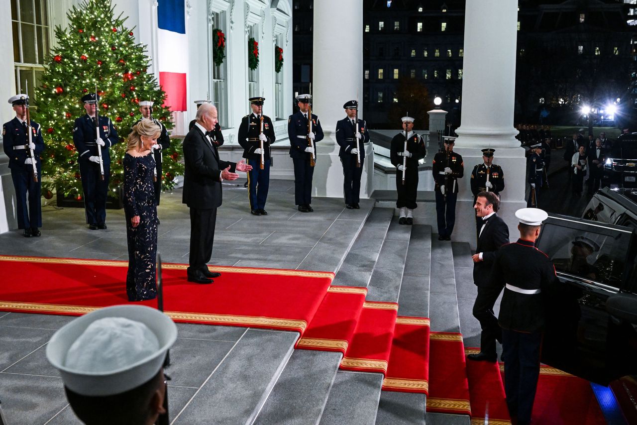 US President Joe Biden and first lady Jill Biden greet French President Emmanuel Macron and his wife, Brigitte Macron, as they arrive for a state dinner at the White House on Thursday, December 1.