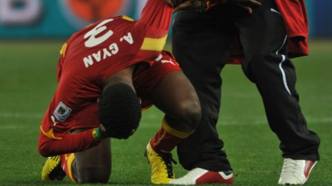 Asamoah Gyan is consoled following the penalty shootout defeat in 2010.