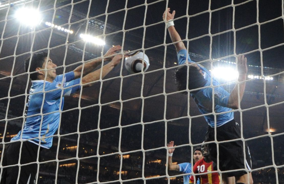 Luis Suárez blocks the shot on the line with his hands.