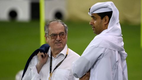 The head of the French Football Federation, Noel Le Graet (L) speaks with  Paris Saint-Germain's Nasser Al-Khelaifi during France's training session at the Jassim-bin-Hamad Stadium in Doha on November 17, 2022, ahead of Qatar 2022.