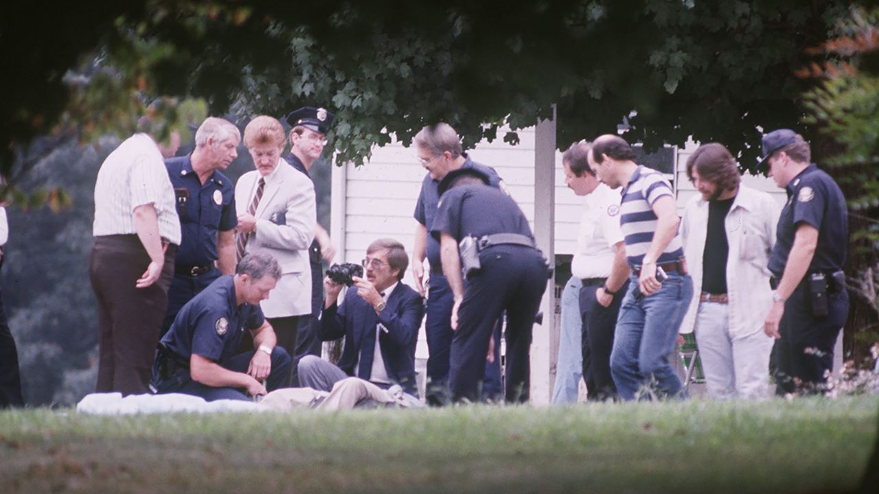 Police and emergency personnel gather after Andrew Thornton was discovered, having parachuted to his death near Island Home Airport in 1985. 