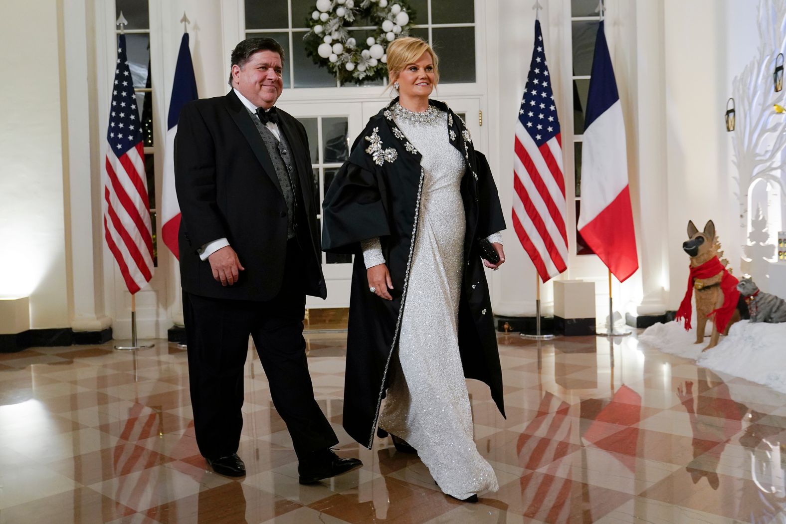 Illinois Gov. J.B. Pritzker arrives with his wife, Mary Kathryn.