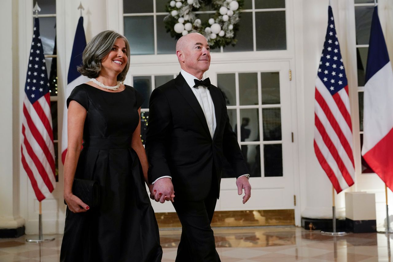 Homeland Security Secretary Alejandro Mayorkas arrives for the dinner with his wife, Tanya.