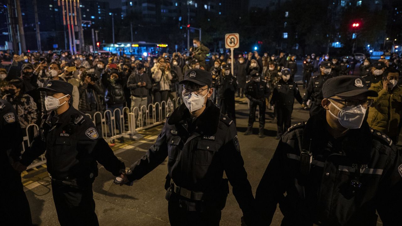 Police form a cordon  during a protest in Beijing on November 27, 2022.