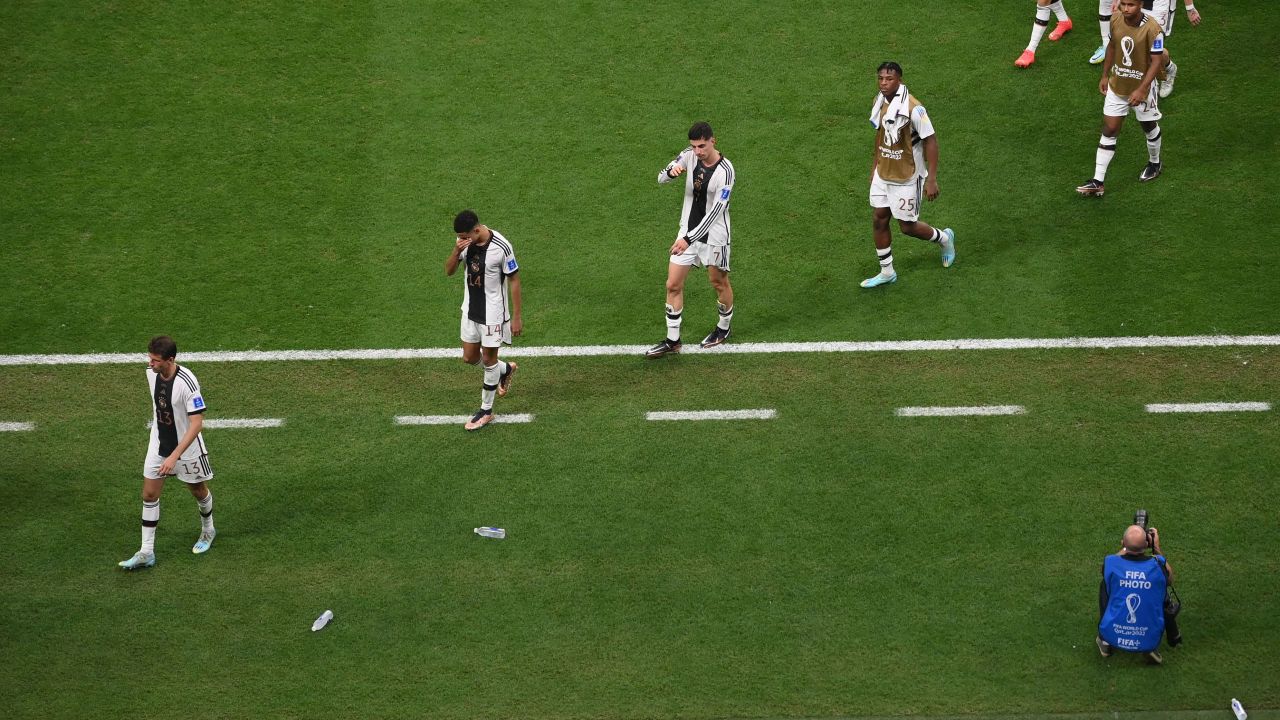 Germany players leave the pitch after they failed to qualify for the last 16 of the 2022 World Cup.