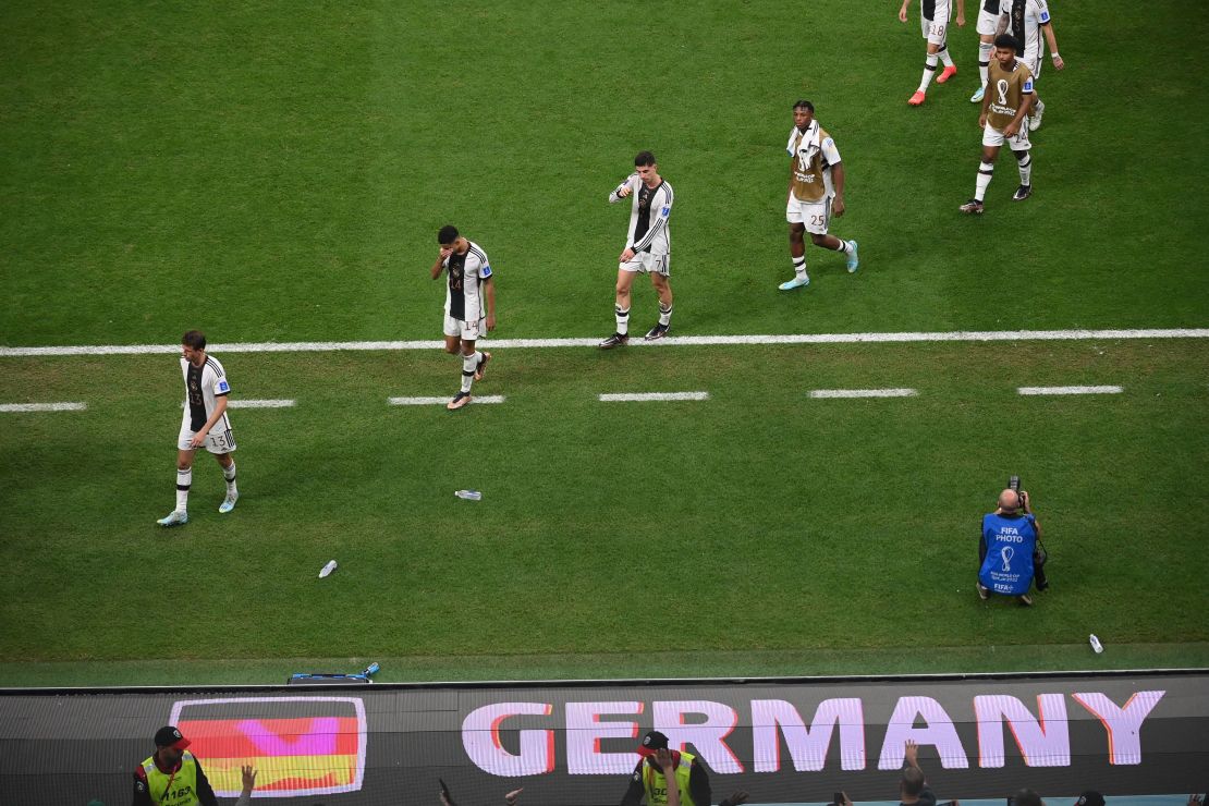 Germany players leave the pitch after they failed to qualify for the last 16 of the 2022 World Cup.