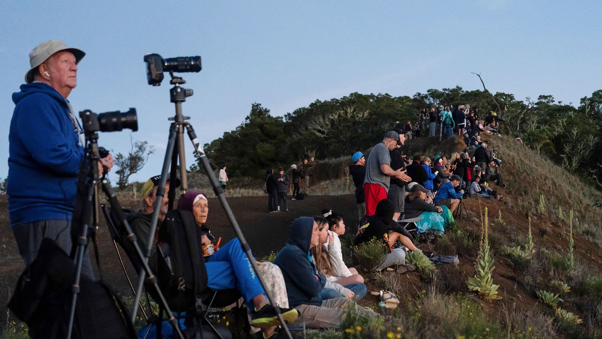 People gather to observe the eruption of Mauna Loa on December 1. 